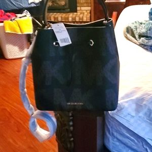 Mk logo handbags  with  large  print.